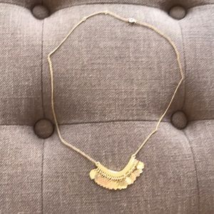 Gold tone leaf print necklace